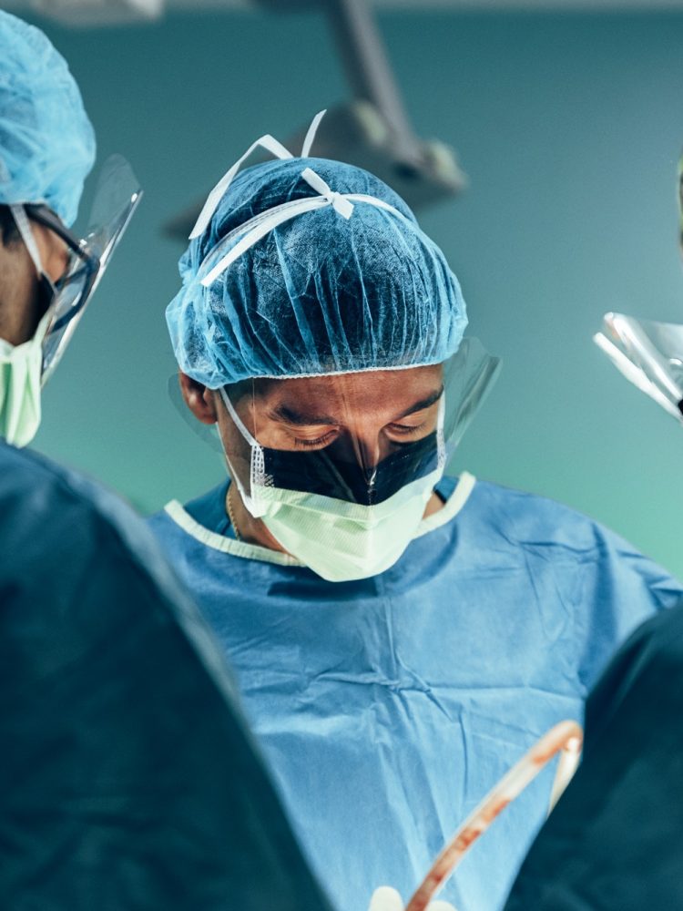 Team of Surgeons Operating.
